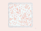 Clear scalloped tray with coral pink floral and bird pattern on white background.