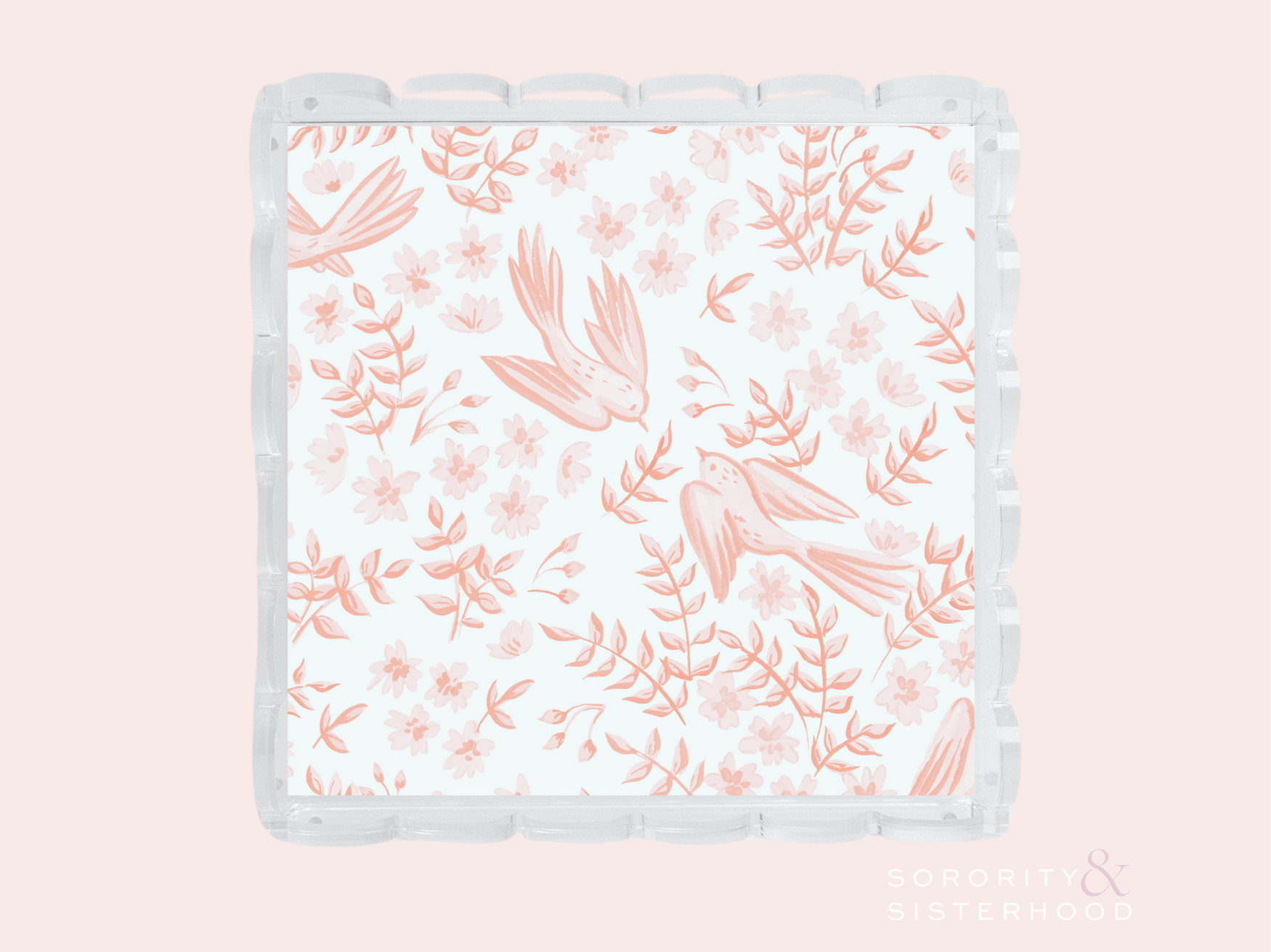 Clear scalloped tray with coral pink floral and bird pattern on white background.