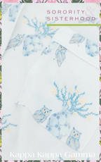 White pajama shorts with blue floral and owl print, soft lightweight fabric.