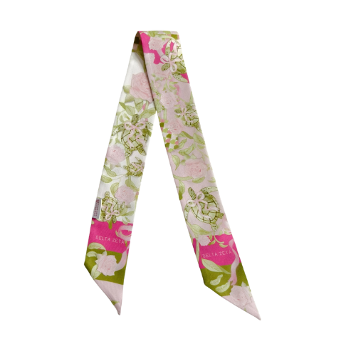 Pink and green floral silk scarflette with Delta Zeta logo and pointed ends.
