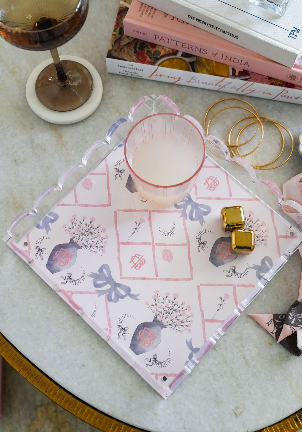 Square scalloped tray with pink bows, floral motifs, and gold detailing on white background.