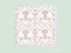 Square acrylic tray with scalloped edges, featuring pink and green floral and ribbon design on white background.