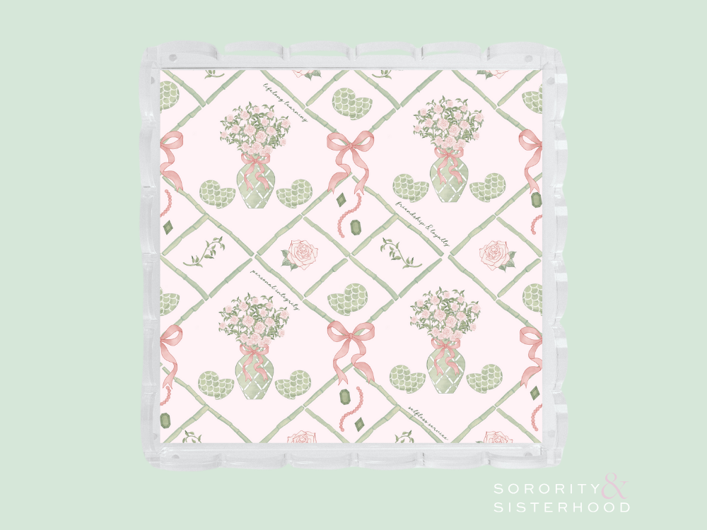 Square acrylic tray with scalloped edges, featuring pink and green floral and ribbon design on white background.