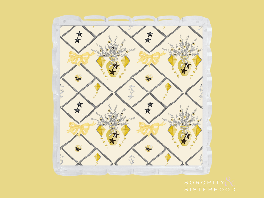 Square ceramic tray with scalloped edges, cream background, gold hearts, bows, and black diamond pattern.