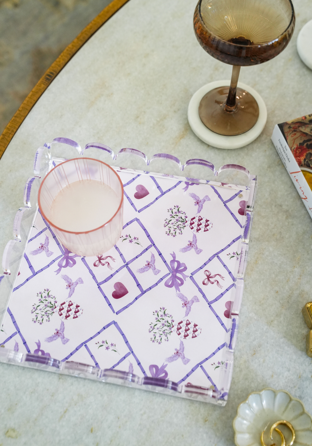 Clear acrylic tray with scalloped edges and purple geometric grapevine pattern.