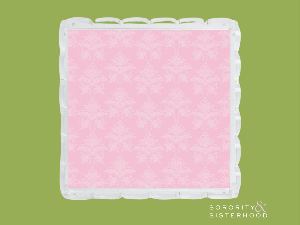 Square acrylic tray with scalloped edges and pink damask patterned center.