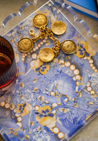 Clear acrylic tray with scalloped edges featuring gold Kappa Kappa Gamma coin charms on a blue and white floral patterned.