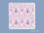 Square acrylic tray with scalloped edges, pink and blue Delta Gamma crest pattern.