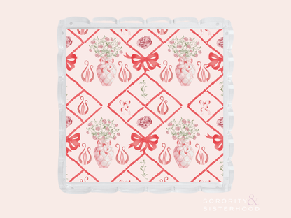 White acrylic tray with scalloped edges featuring red Alpha Chi Omega logos and floral designs in a diamond pattern.