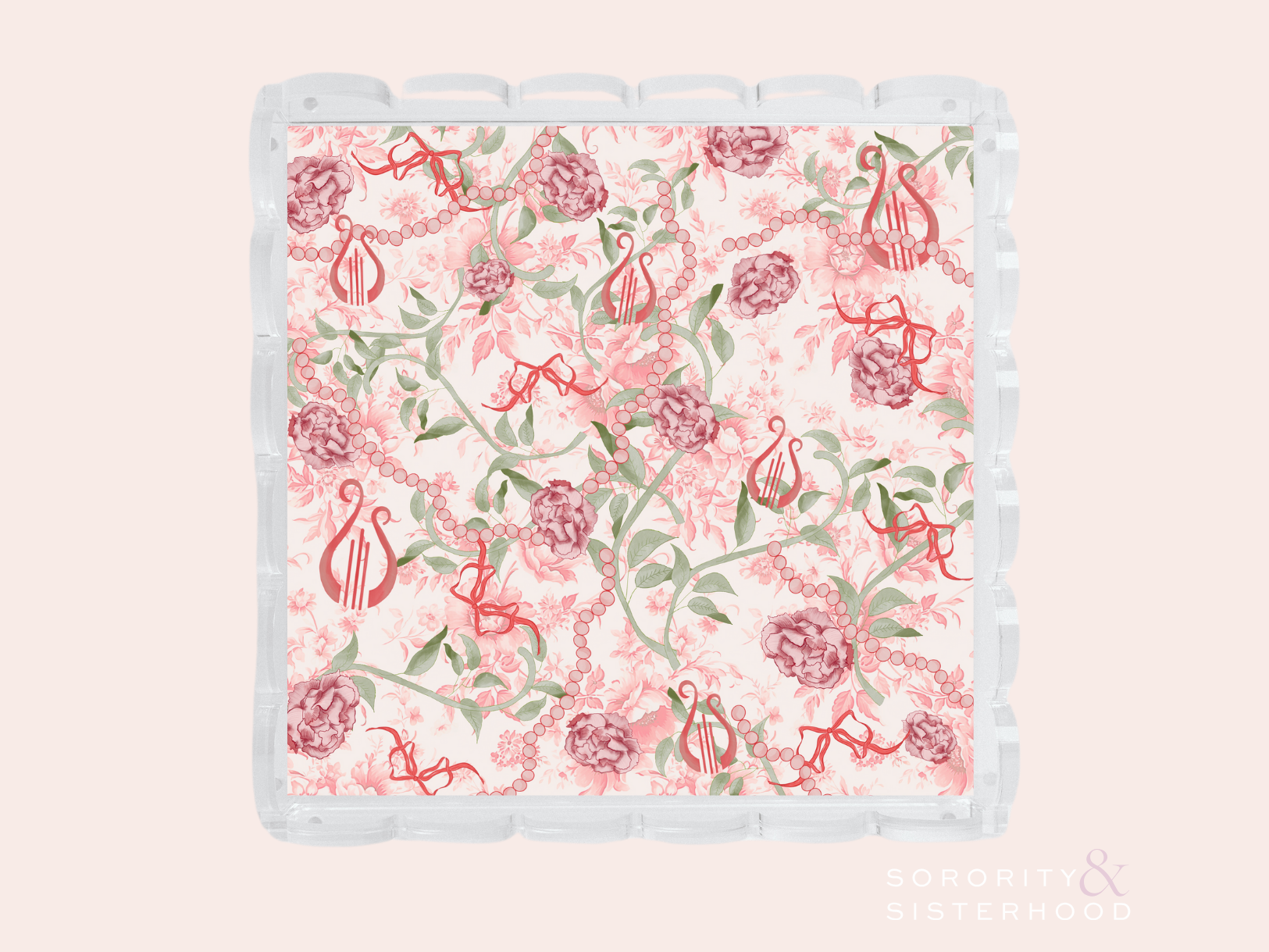Acrylic tray with scalloped edges featuring a floral and Alpha Chi Omega symbol pattern in pink and green.