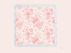 Clear acrylic tray with scalloped edges and pink floral pattern on base.