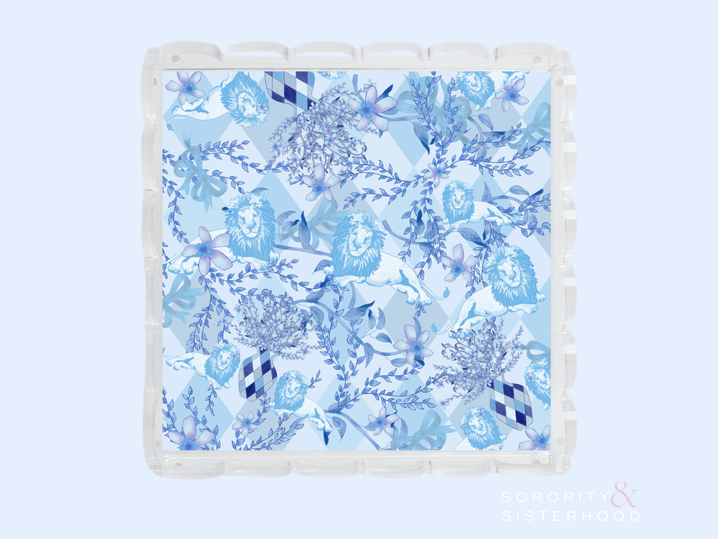 Clear acrylic tray with scalloped edges and blue floral pattern design.
