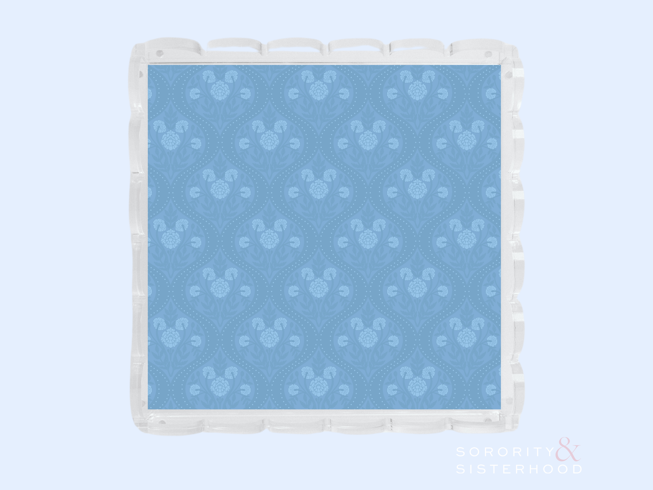 Blue acrylic tray with scalloped edges and subtle floral pattern embossed on surface.