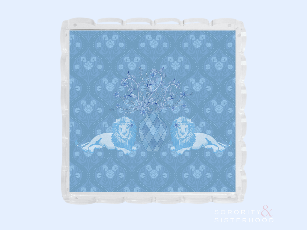 Clear acrylic tray with scalloped edges featuring a blue patterned insert with two lions and a central crest design.