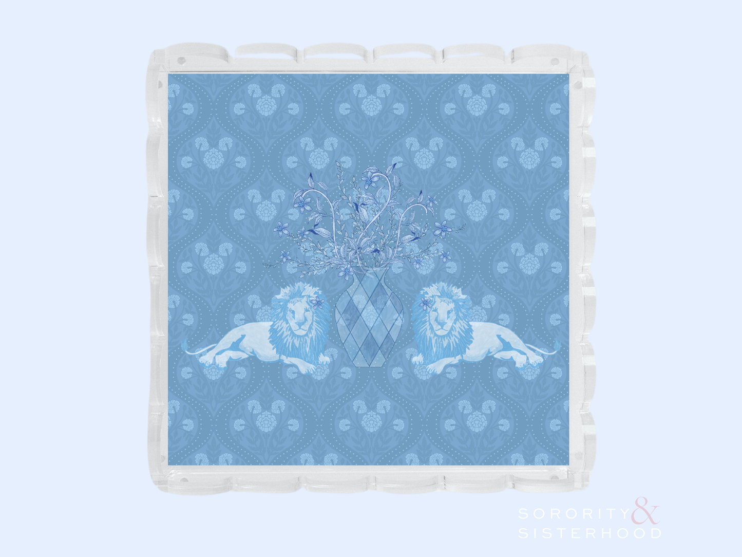 Clear acrylic tray with scalloped edges featuring a blue patterned insert with two lions and a central crest design.