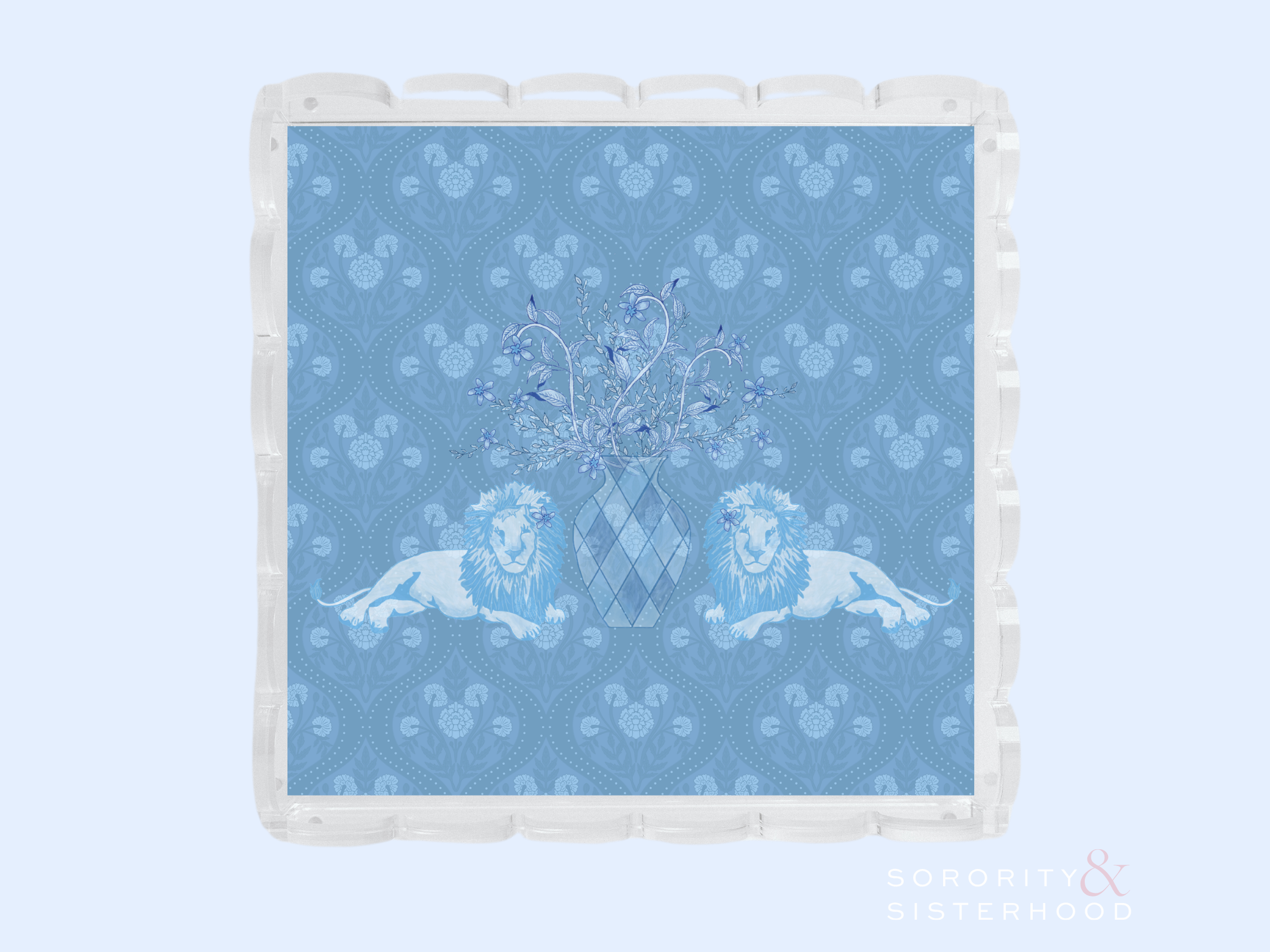 Clear acrylic tray with scalloped edges featuring a blue patterned insert with two lions and a central crest design.