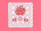 Square acrylic tray with scalloped edges, pink geometric pattern, and red floral accents.