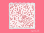 Square acrylic tray with scalloped edges and pink floral and leaf pattern.