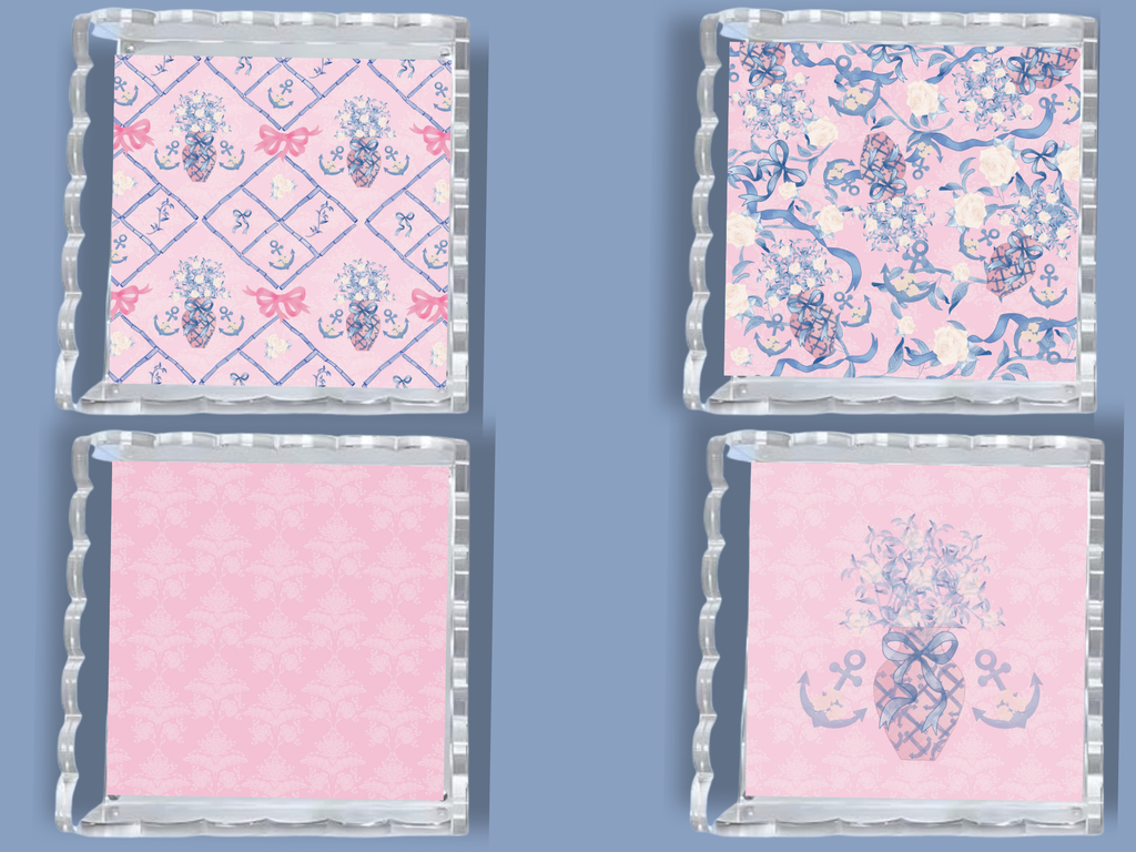 Set of two square acrylic trays with scalloped edges, featuring pink backgrounds and blue nautical and floral motifs.