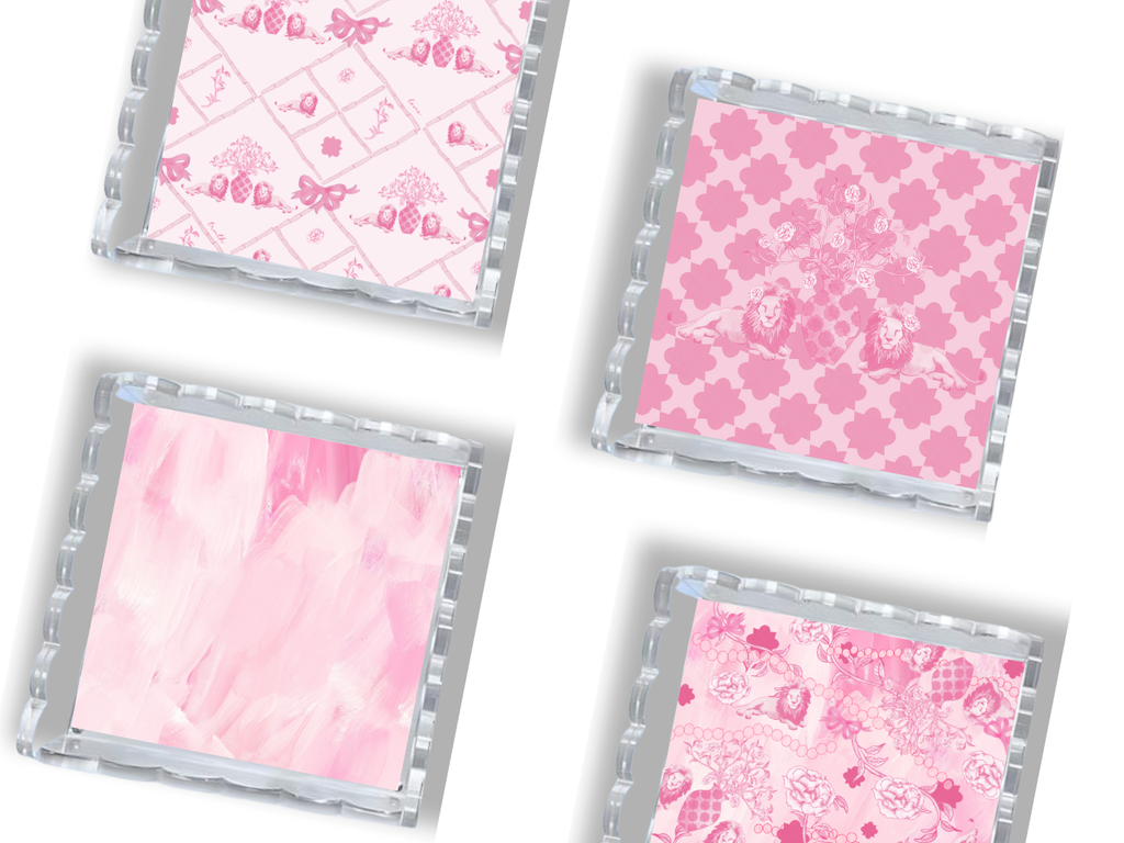 Set of four clear trays with silver scalloped edges, each tray featuring different pink Phi Mu-themed patterns.