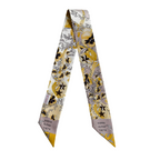 Silk scarflette with yellow, black, and gray floral design and Kappa Alpha Theta text on beige ends.