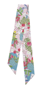 Silk scarflette with colorful Mahjong tile and floral pattern on pastel background.